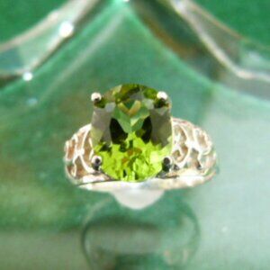 Peridot solitaire in Sterling silver - Size 8  Stone is a really nice green